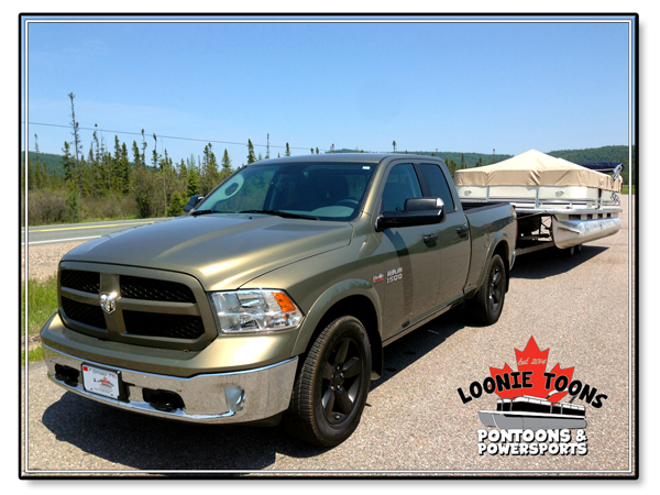 Loonie Toons Pontoons and Power Sports Pontoon Boat Delivery Service Vehicle with Attached Pontoon Boat